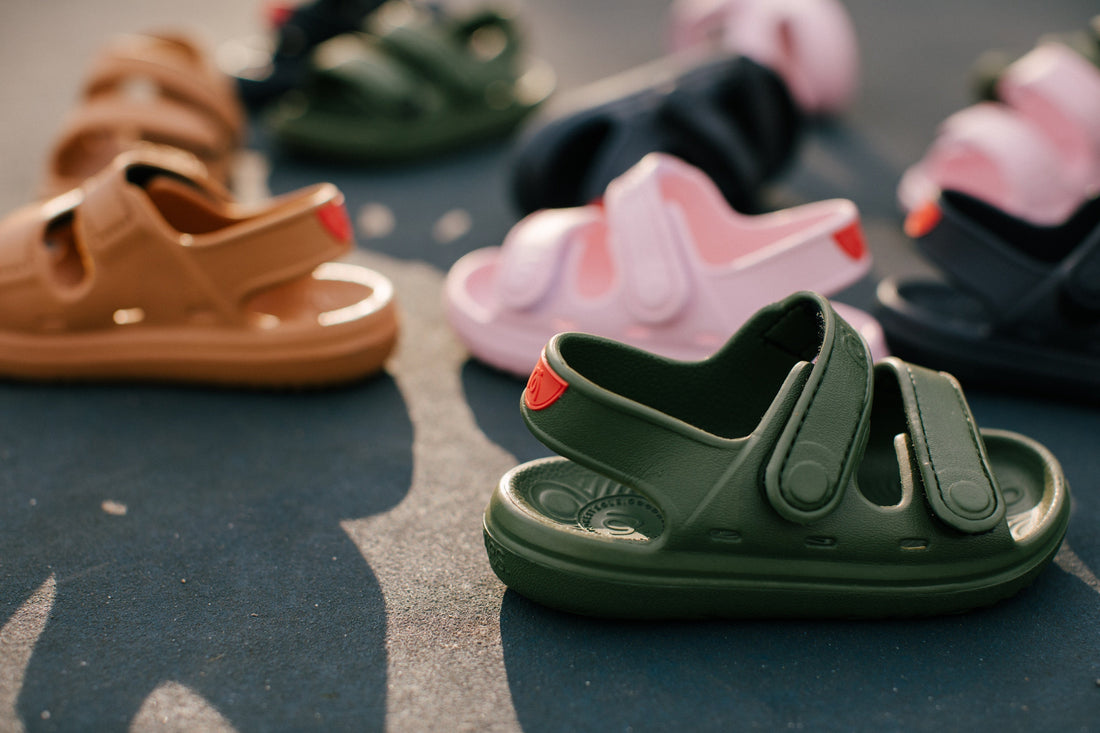 Simples children’s sandals in green, pink, brown, and black, designed for everyday comfort